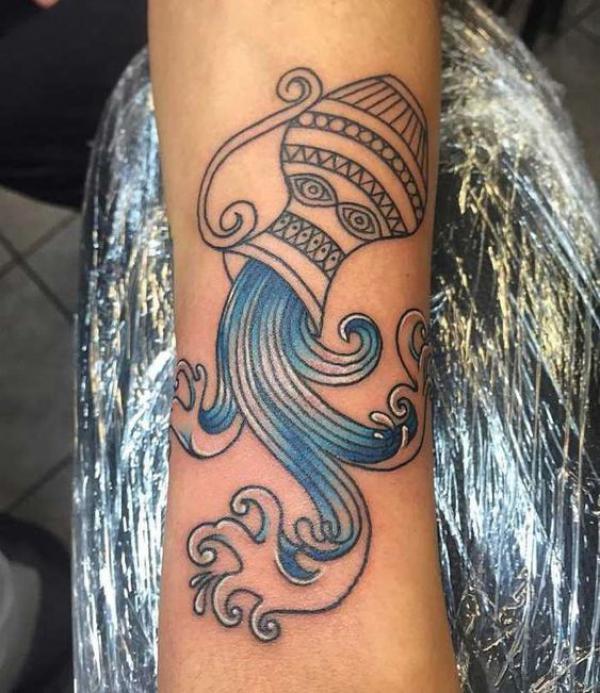 Aquarius water bearer pouring water tattoo