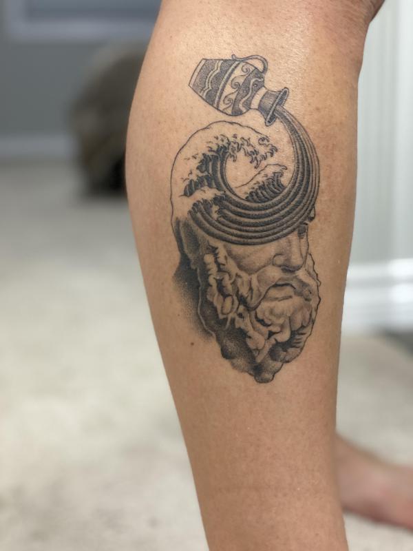 Aquarius water bearer tattoo leg
