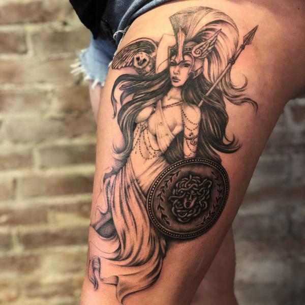 Athena with shield tattoo on thigh