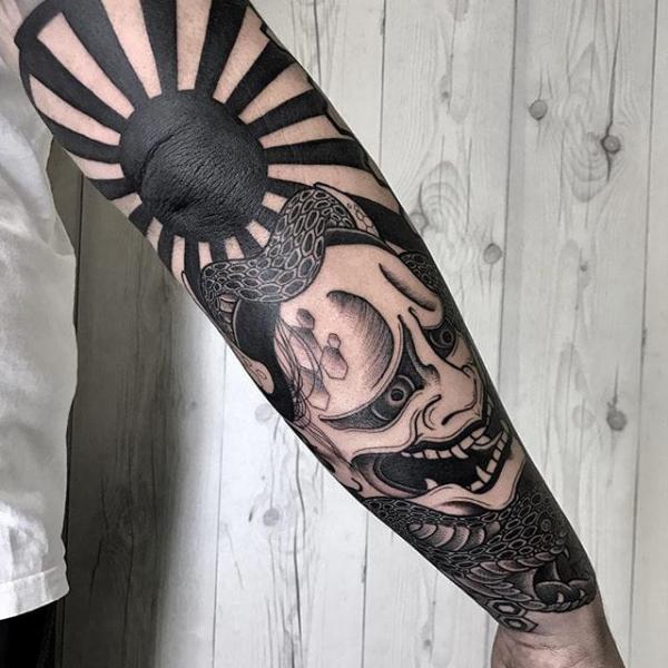 Black and white Japanese sun and Hannya tattoo sleeve