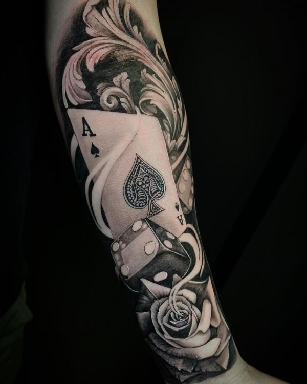 Black and white ace of spade dice and rose with smoke tattoo