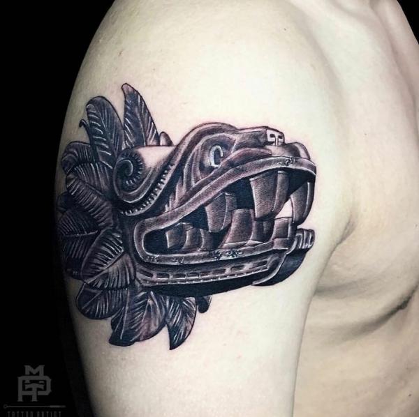 Blackwork Quetzalcoatl head tattoo