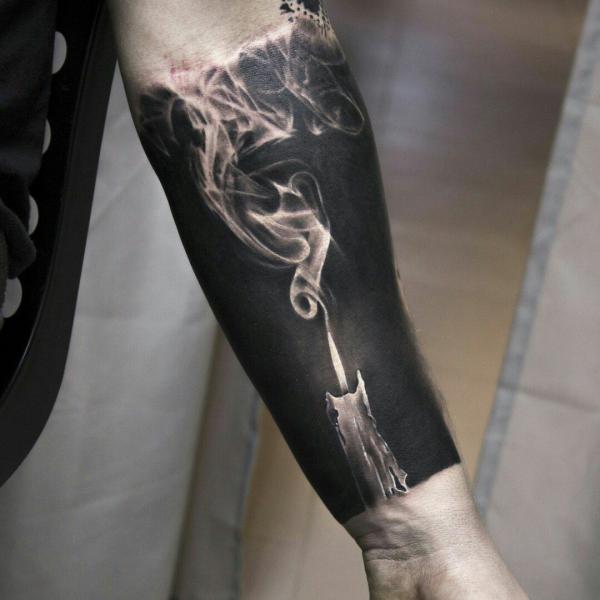 Blackwork candle smoke tattoo forearm
