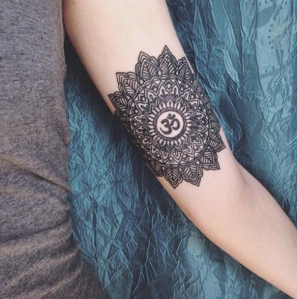 Blackwork mandala OM tattoo forearm