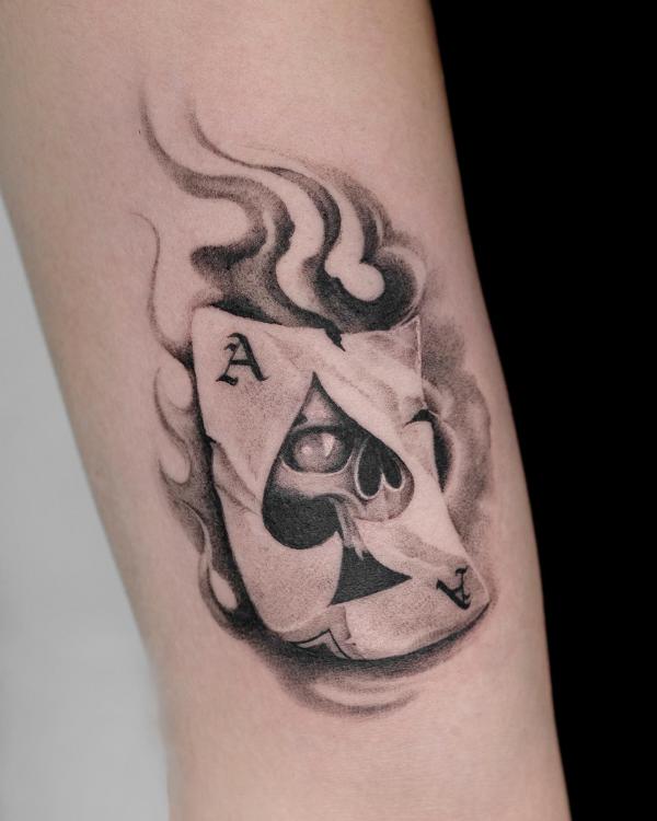 Burning ace of spade with eye tattoo