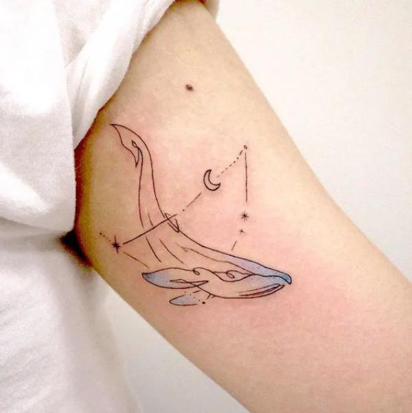 Capricorn constellation and whale line work tattoo