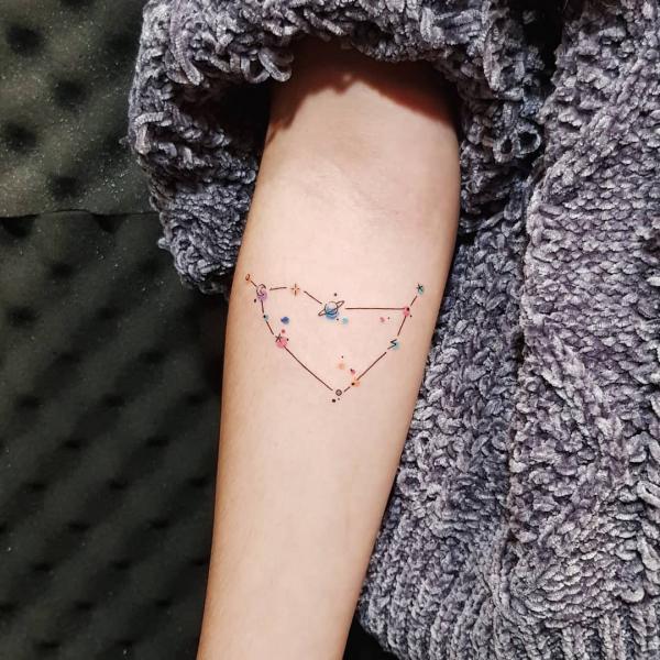 Capricorn constellation tattoo on inner forearm