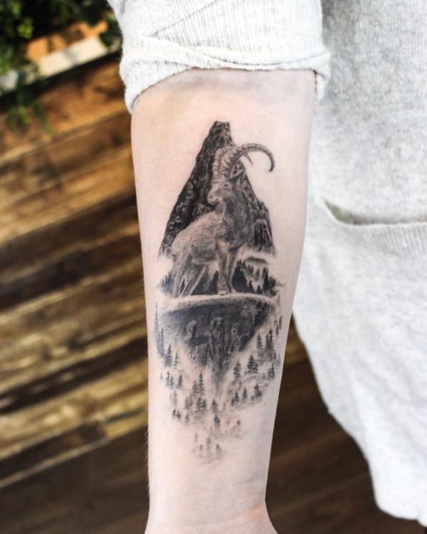 Capricorn goat and earth forest tattoo