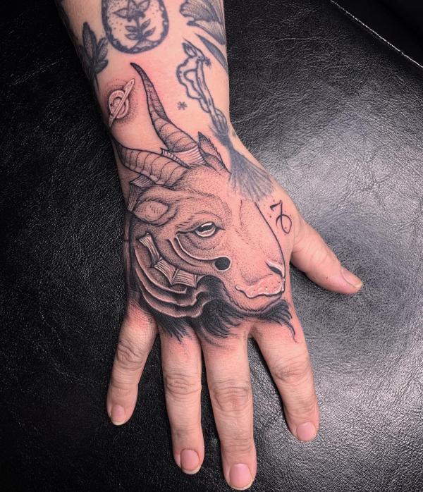 Capricorn goat head tattoo on hand
