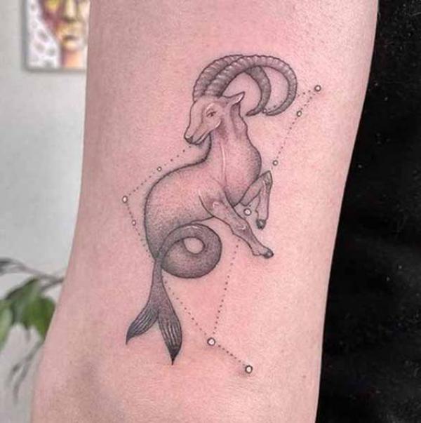 Capricorn sea goat and constellation tattoo