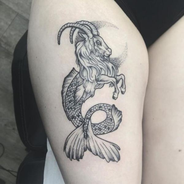 Capricorn sea goat and crescent moon tattoo thigh