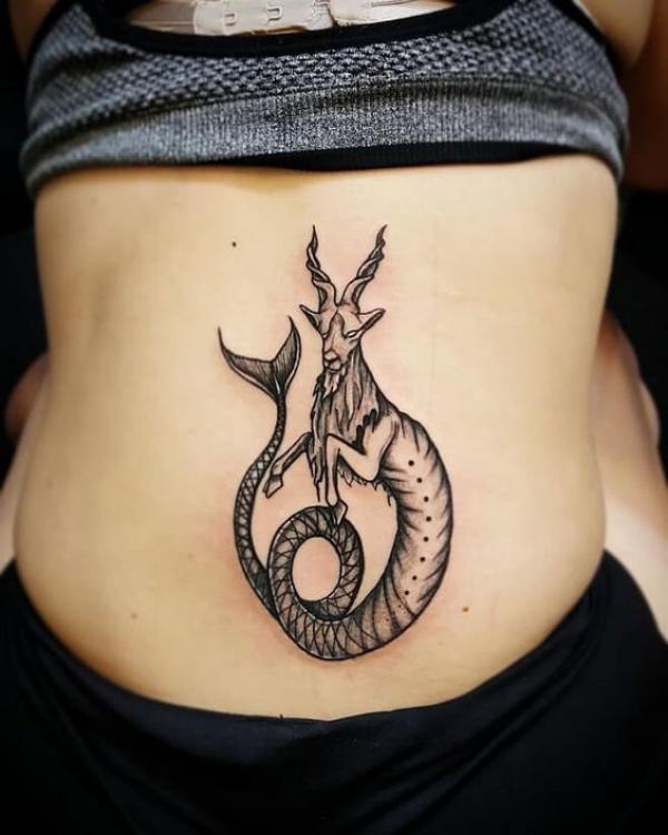 Capricorn sea goat low back tattoo