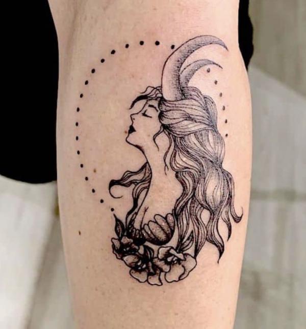 Capricorn woman with rose tattoo