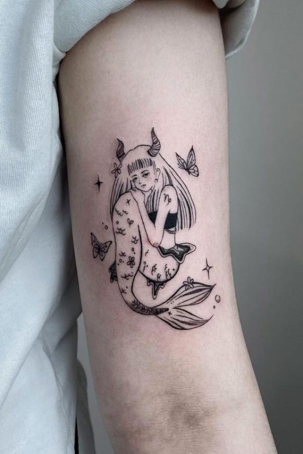 Capricorn woman with stars and butterflies Tattoo