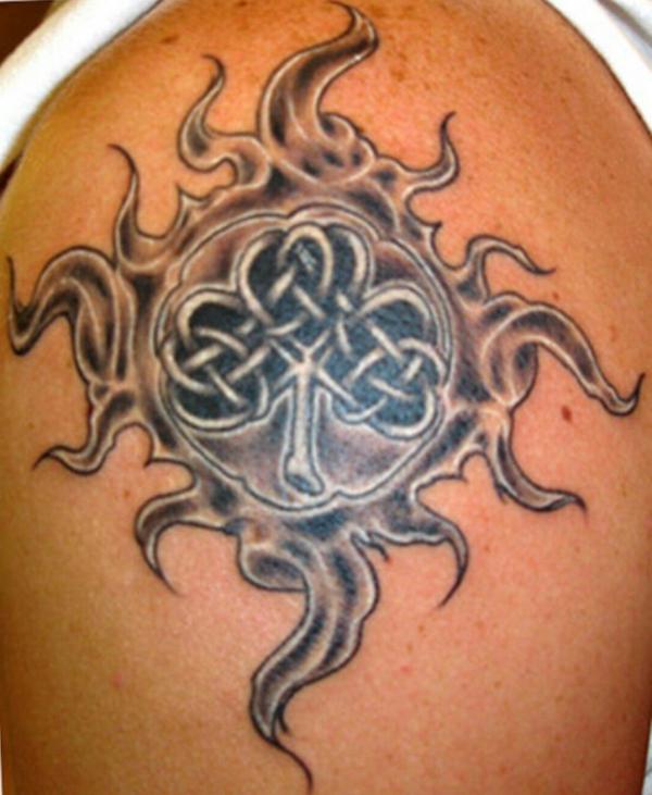 Celtic sun with clover tattoo shoulder