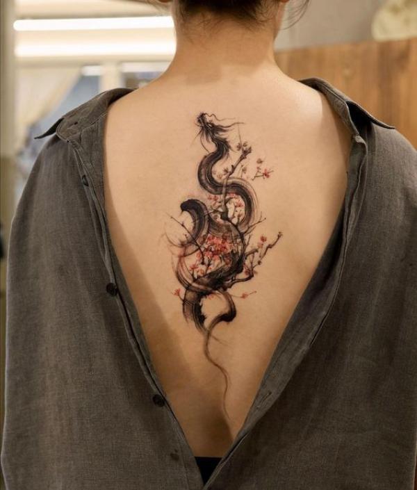 Cherry blossom and dragon in smoke back tattoo
