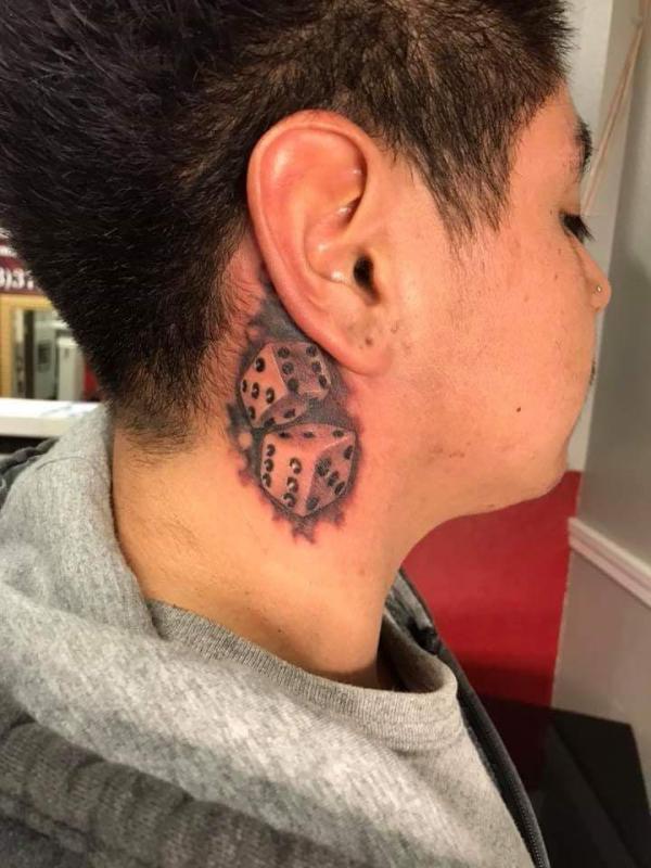 Dice neck tattoo