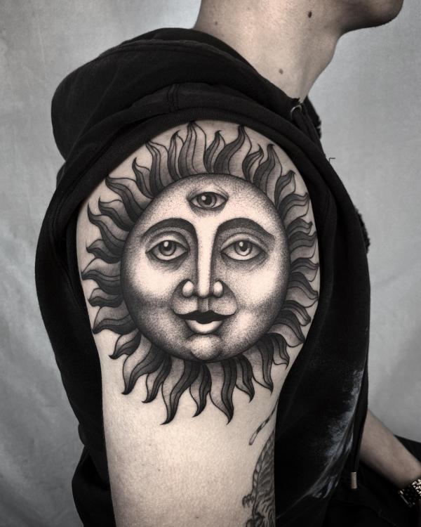 Dotwork sun face with three eyes tattoo