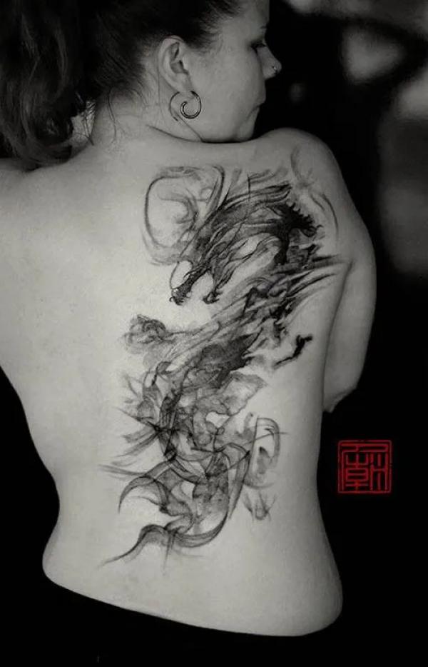 Dragon in smoke tattoo on back