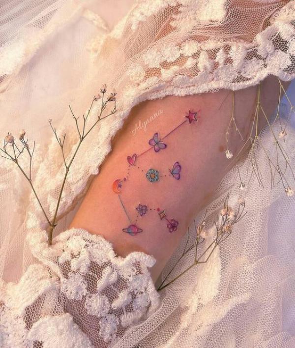 Feminine Aquarius constellation tattoo