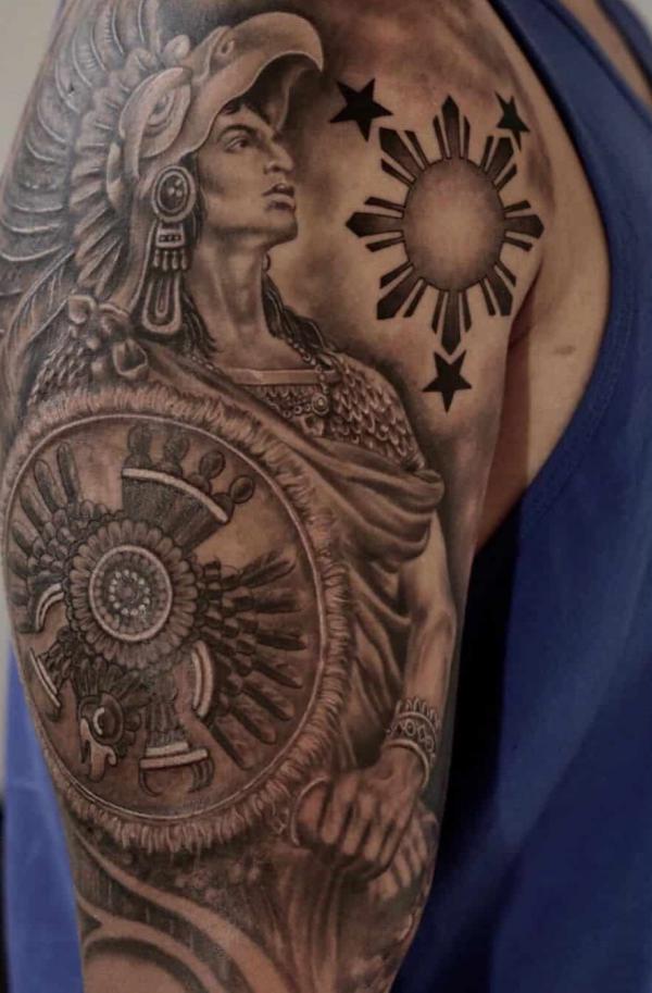 Filipino sun and Aztec warrior tattoo half sleeve