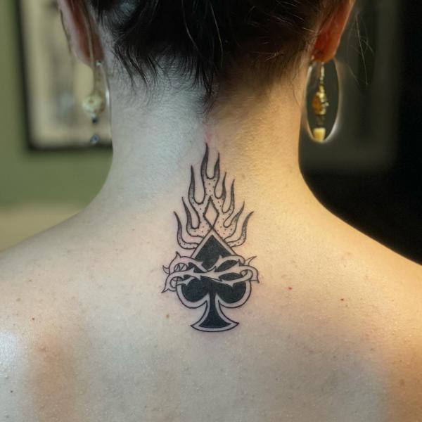 Fire and ace of spade wrapped with barbed wire tattoo nape