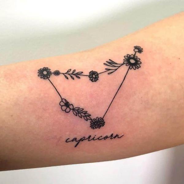 Floral Capricorn constellation tattoo