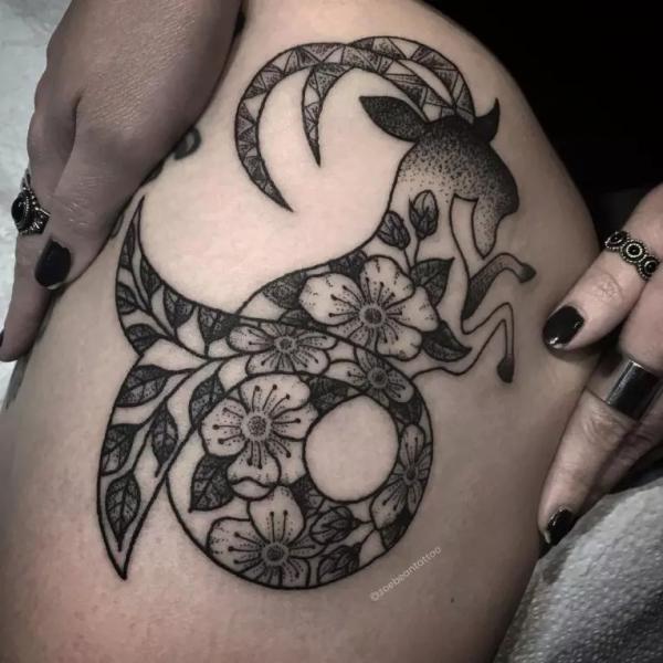 Floral Capricorn sea goat tattoo on thigh