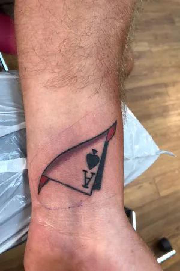 Folded Ace of spade wrist tattoo