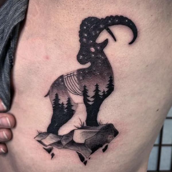Forest and starry night Capricorn goat tattoo