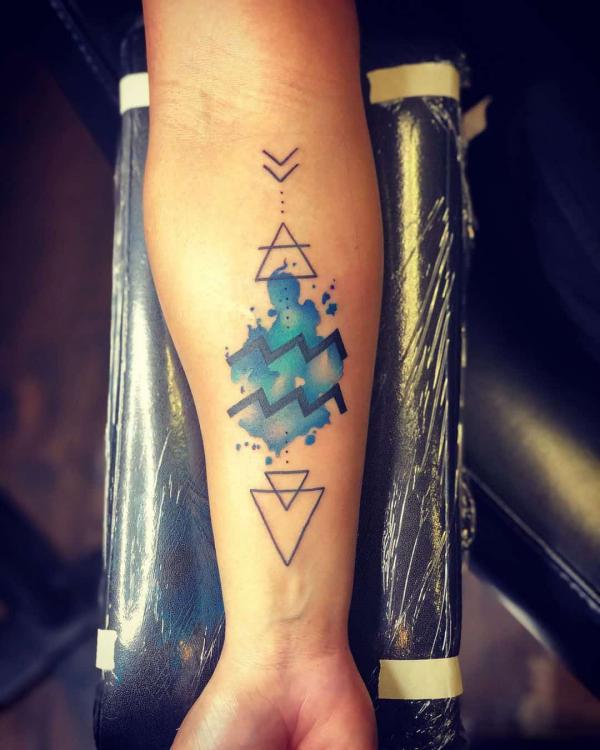 Geometric Aquarius tattoo forearm