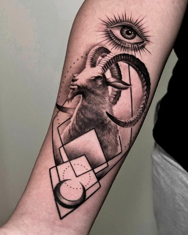 Geometric Capricorn with eye and crescent moon tattoo