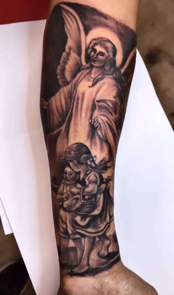 Guardian angel and kids tattoo forearm