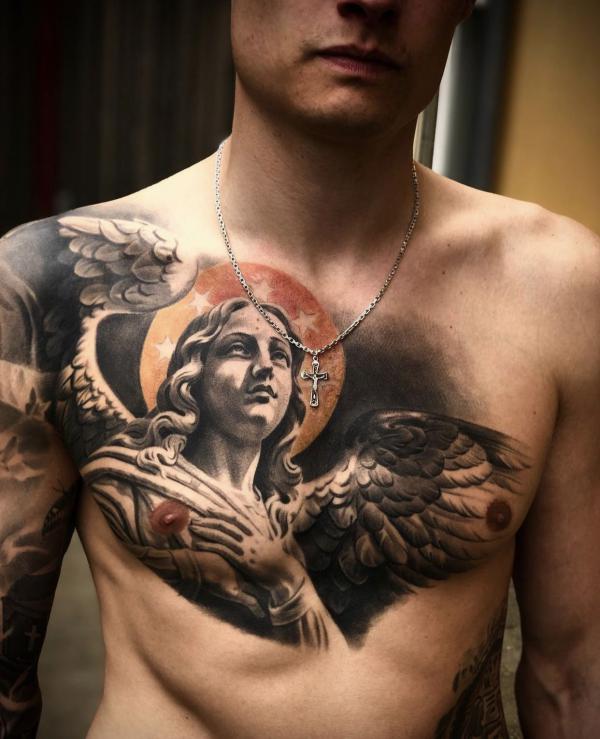 Guardian angel and sun tattoo chest