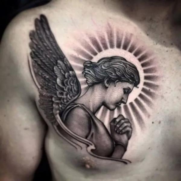 Guardian angel and sun tattoo on chest
