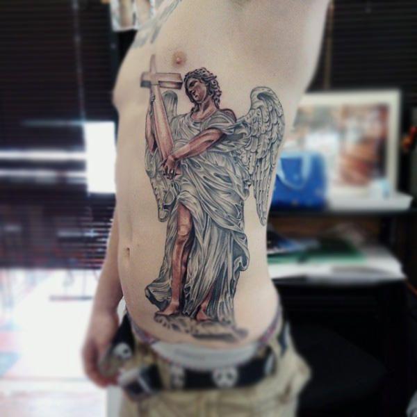 Guardian angel holding a cross tattoo side