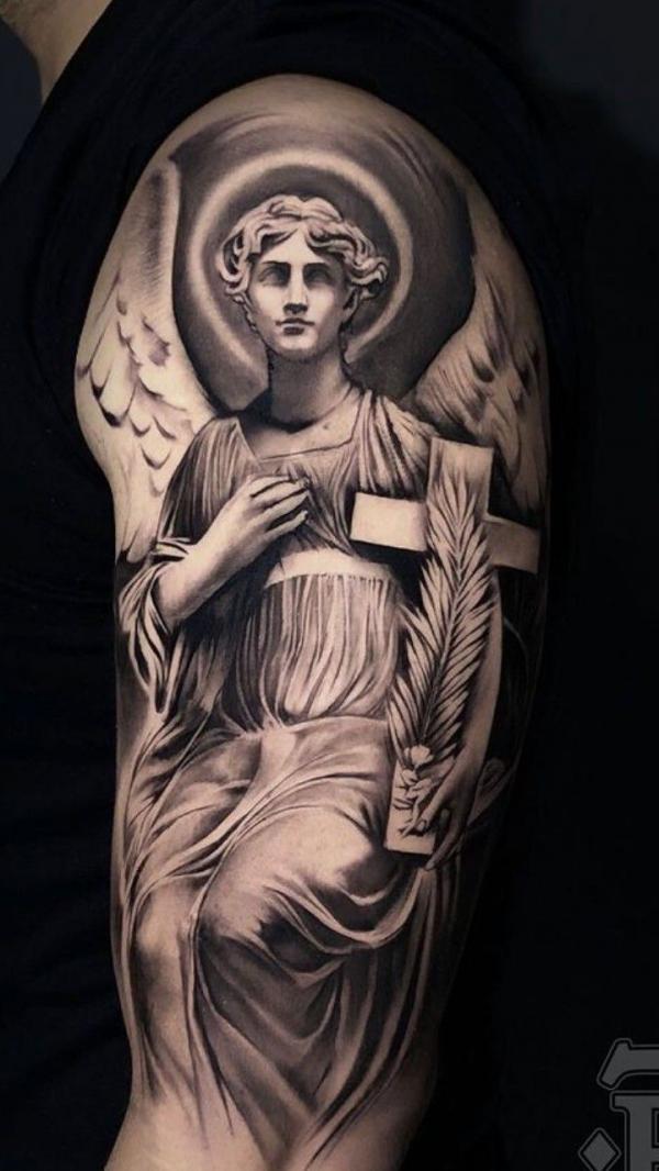 Guardian angel holding a cross with feather tattoo