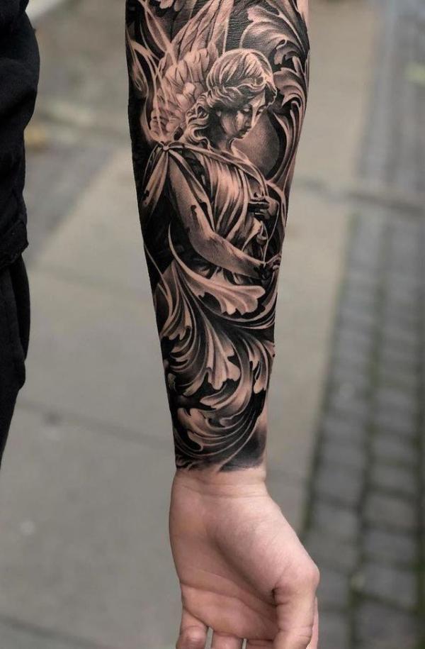 Guardian angel tattoo on inner forearm