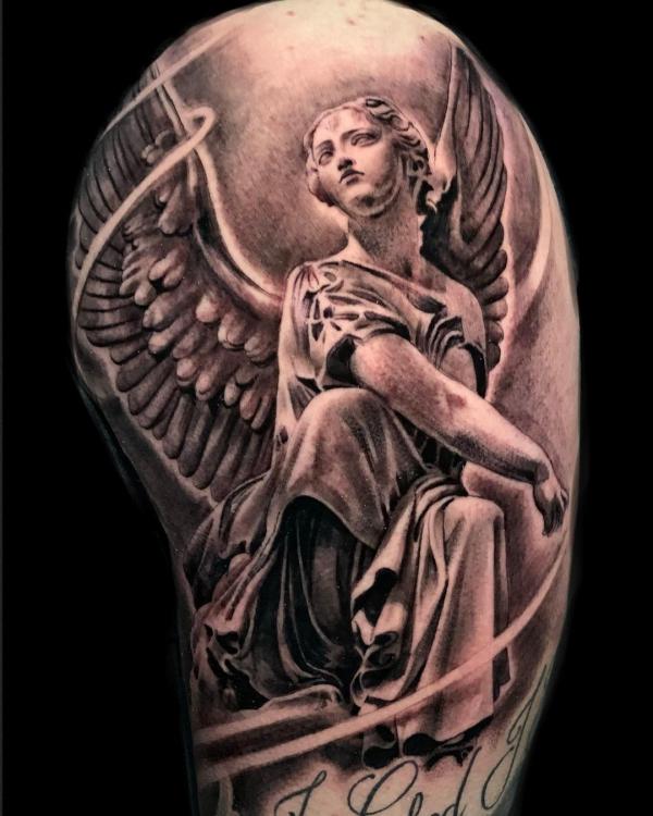 Guardian angel upper arm tattoo
