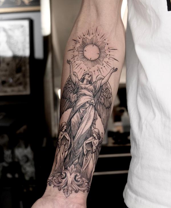 Guardian angel with sun tattoo