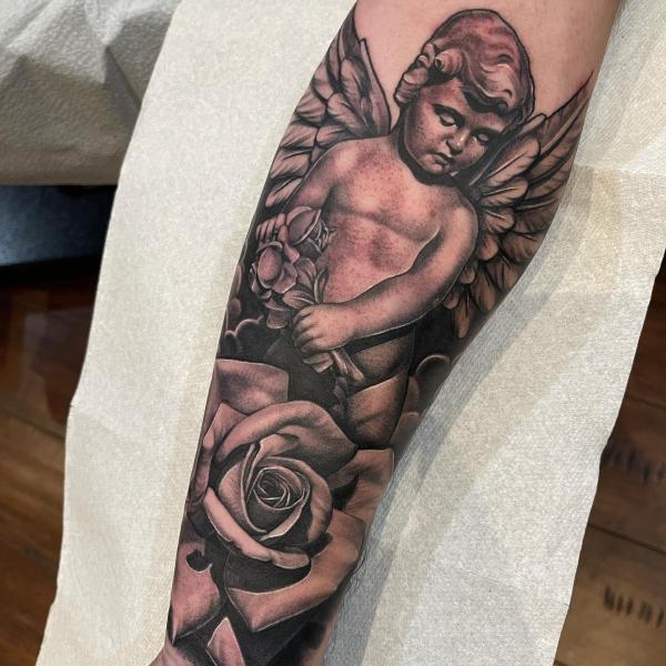 Guardian cherub angel and rose tattoo forearm