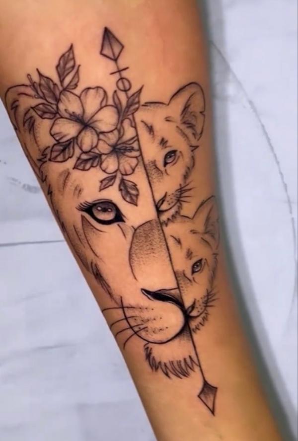 Half lioness and half cubs with flowers tattoo
