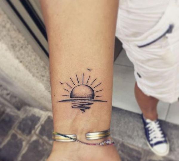 Half sun tattoo wrist