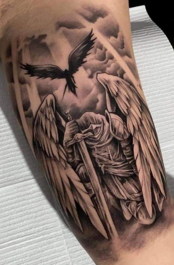 Kneeling Guardian angel with sword tattoo