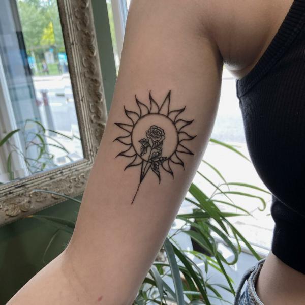 Linework sun and flower tattoo