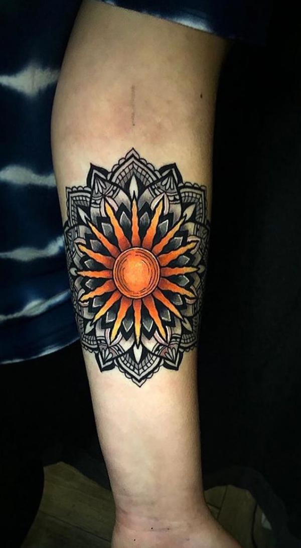 Mandala sun tattoo forearm