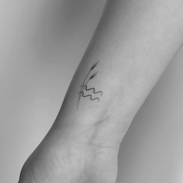 Minimalist Aquarius glyph tattoo