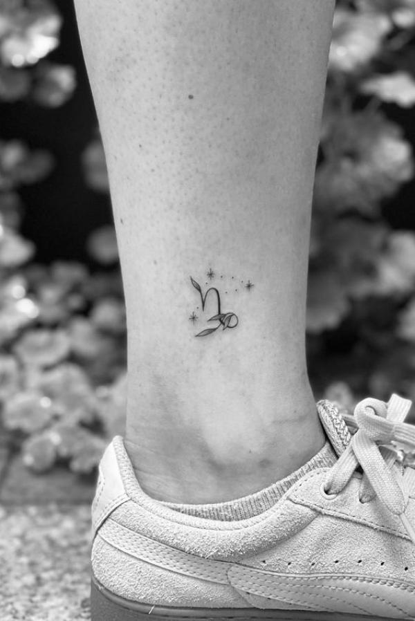 Minimalist Capricorn glyph and constellation tattoo ankle