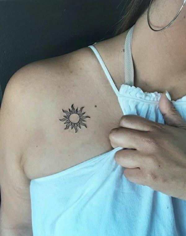 Minimalist sun clavicle tattoo