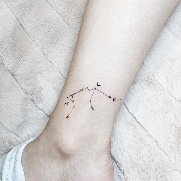 Minmalist Aquarius constellation with planet moon and stars tattoo